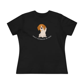 Easily Distracted Women's Premium Tee in Black. Shown is front design featuring a dog waving with the saying "Easily Distracted by Dogs" below it. The back of shirt has the classic Benefit Beagle Logo.