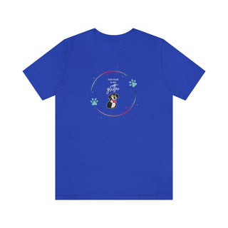 Dog Hair is my Glitter Unisex Jersey Short Sleeve Tee in True Royal. The Dog Hair is my Glitter design features a dog with the phrase "Dog Hair is my Glitter" above it and it is surrounded by a circle with paw prints.