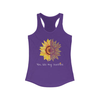 You are my Sunshine Women's Racerback Tank in Purple Rush. Shown is the front showcasing a sunflower which is split down the middle and half is made out of paw prints. Underneath is the phrase "You are my Sunshine" . Back of shirt features the Sunflower Benefit Beagle Logo.