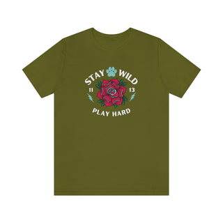 Stay Wild Unisex Premium Tee in Olive. Shown is front of Stay Wild Design features a tattoo style rose with the phrase "Stay Wild, Play Hard" around it. The back of shirt features the Stay Wild Benefit Beagle Logo Design.