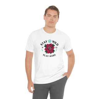 Stay Wild Unisex Premium Tee in White. Shown is front of Stay Wild Design features a tattoo style rose with the phrase "Stay Wild, Play Hard" around it. The back of shirt features the Stay Wild Benefit Beagle Logo Design.