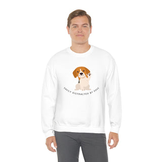 Easily Distracted Unisex Heavy Blend Crewneck Sweatshirt in White. Shown is front design featuring a dog waving with the saying "Easily Distracted by Dogs" below it. The back of shirt has the classic Benefit Beagle Logo.