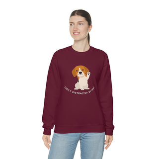 Easily Distracted Unisex Heavy Blend Crewneck Sweatshirt in Maroon. Shown is front design featuring a dog waving with the saying "Easily Distracted by Dogs" below it. The back of shirt has the classic Benefit Beagle Logo.