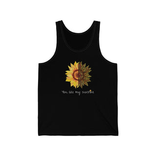 You are my Sunshine Unisex Jersey Tank in Black. Shown is the front showcasing a sunflower which is split down the middle and half is made out of paw prints. Underneath is the phrase "You are my Sunshine" . Back of shirt features the Sunflower Benefit Beagle Logo.