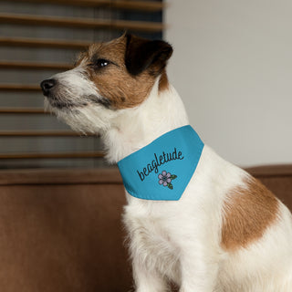 Dog wearing the Signature Tattoo Flower Dog Collar Bandana in Blue. The Signature Tattoo Flower design features the word "beagletude" with a tattoo style flower under it. Comes with adjustable black collar.