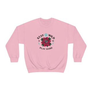 Stay Wild Unisex Heavy Blend Crewneck Sweatshirt in Pink. The Stay Wild Design features a tattoo style rose with the phrase "Stay Wild, Play Hard" around it. The back of shirt features the Stay Wild Benefit Beagle Logo Design.