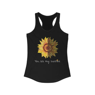 You are my Sunshine Women's Racerback Tank in Black. Shown is the front showcasing a sunflower which is split down the middle and half is made out of paw prints. Underneath is the phrase "You are my Sunshine" . Back of shirt features the Sunflower Benefit Beagle Logo.