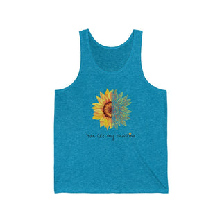 You are my Sunshine Unisex Jersey Tank in Aqua Triblend. Shown is the front showcasing a sunflower which is split down the middle and half is made out of paw prints. Underneath is the phrase "You are my Sunshine" . Back of shirt features the Sunflower Benefit Beagle Logo.