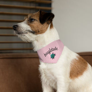 Dog wearing the Signature Tattoo Roses Dog Collar Bandana in Pink. The Signature Tattoo Roses design features the word "beagletude" with a tattoo style rose under it. Comes with adjustable black collar.