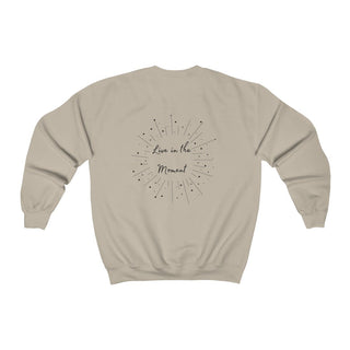 Live in the Moment Crewneck Sweatshirt in Sand. The Live in the Moment design features a graphic on the back with the phrase "Live in the Moment" surrounded by shooting stars.