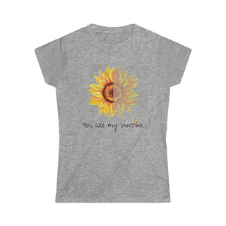 You are my Sunshine Women's Softstyle Tee in Sport Grey. Shown is the front showcasing a sunflower which is split down the middle and half is made out of paw prints. Underneath is the phrase "You are my Sunshine" . Back of shirt features the Sunflower Benefit Beagle Logo.