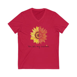 You are my Sunshine Unisex V-Neck Tee in Red. Shown is the front showcasing a sunflower which is split down the middle and half is made out of paw prints. Underneath is the phrase "You are my Sunshine" . Back of shirt features the Sunflower Benefit Beagle Logo.