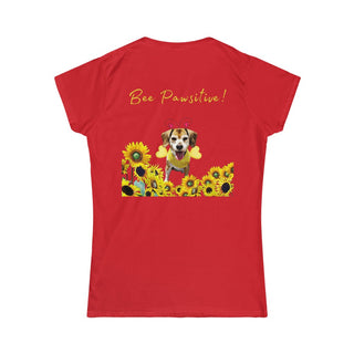 Bee Pawsitive Women's Softstyle Tee in Red. Shown is back of shirt showcasing a dog dressed as as bee in a a field of sunflowers with the phrase "Bee Pawsitive!" above it. The front features the Bee Pawsitive Benefit Beagle Logo.