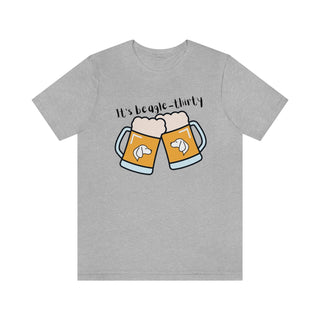 Beagle-Thirty Mugs Unisex Jersey Short Sleeve Tee in Athletic Heather. The front of shirt showcases Two Dog Adorned Mugs clinking with the saying, "It's Beagle-Thirty" above it. Back of shirt features corresponding Benefit Beagle Logo.