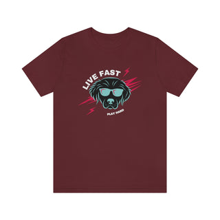 Play Hard Unisex Jersey Short Sleeve Tee Shirt in Maroon. The design features a cool dog with sunglasses and lightening bolts arond it. The phrase "Live Fast, Play Hard" is around the design.