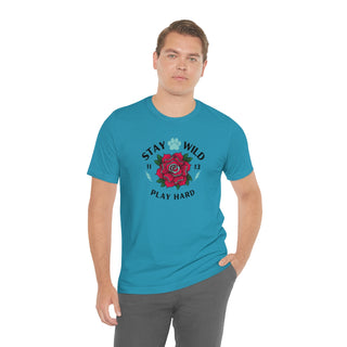 Stay Wild Unisex Premium Tee in Aqua. Shown is front of Stay Wild Design features a tattoo style rose with the phrase "Stay Wild, Play Hard" around it. The back of shirt features the Stay Wild Benefit Beagle Logo Design.