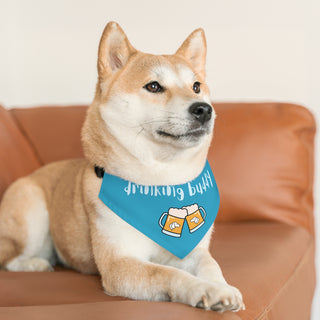 Dog wearing Beagle-Thirty Mugs Dog Collar Bandana in Blue. The Beagle-Thirty Mugs design features two dog adorned mugs clinking with the saying "Drinking buddy" above it. Comes with adjustable black collar.