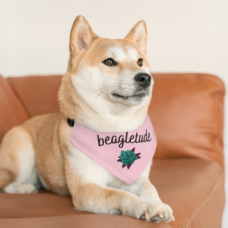 Dog wearing the Signature Tattoo Roses Dog Collar Bandana in Pink. The Signature Tattoo Roses design features the word "beagletude" with a tattoo style rose under it. Comes with adjustable black collar.