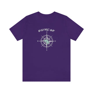 Adventures Await Unisex Jersey Short Sleeve Tee in Purple. The front of shirt features the Adventures Await design with a dog inside a nautical compass and the words "Adventures Await" above it. The back of the shirt has similar Benefit Beagle Logo.