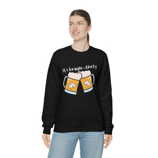 Beagle-Thirty Mugs Unisex Heavy Blend Crewneck Sweatshirt in Black. The front of shirt showcases Two Dog Adorned Mugs clinking with the saying, "It's Beagle-Thirty" above it. Back of shirt features corresponding Benefit Beagle Logo.