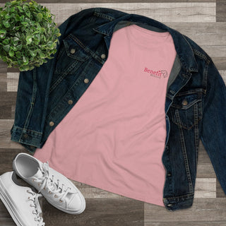 Different Pawspective Women's Premium Tee in Pink. Shown is front of shirt with Benefit Beagle logo in the top corner . On the back is large colorful pawprint with the the phrase "Life is all about finding the beauty in a different pawspective" circled around it.