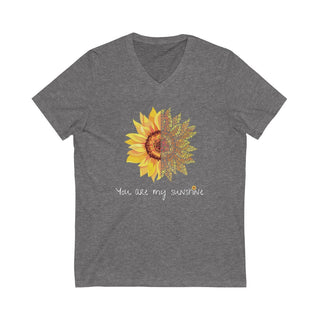 You are my Sunshine Unisex V-Neck Tee in Deep Heather. Shown is the front showcasing a sunflower which is split down the middle and half is made out of paw prints. Underneath is the phrase "You are my Sunshine" . Back of shirt features the Sunflower Benefit Beagle Logo.