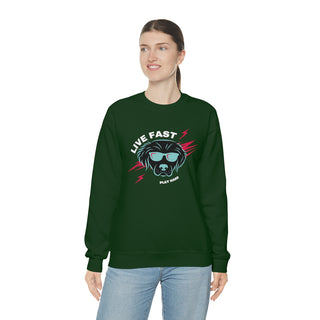 Play Hard Unisex Heavy Blend Crewneck Sweatshirt in Forest Green. The design features a cool dog with sunglasses and lightening bolts around it. The phrase "Live Fast, Play Hard" is around the design.