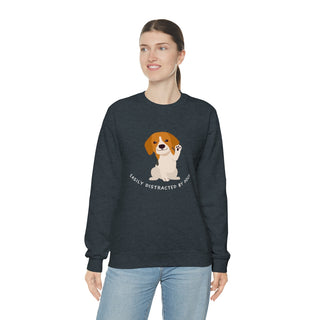 Easily Distracted Unisex Heavy Blend Crewneck Sweatshirt in Dark Heather. Shown is front design featuring a dog waving with the saying "Easily Distracted by Dogs" below it. The back of shirt has the classic Benefit Beagle Logo.