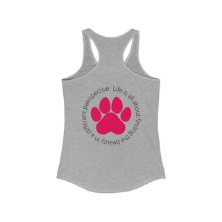 Different Pawspective Women's Racerback Tank in Heather Grey. Shown is the back of shirt featuring a large colorful pawprint with the the phrase "Life is all about finding the beauty in a different pawspective" circled around it. The Benefit Beagle Logo is located in the top corner on the front of shirt.