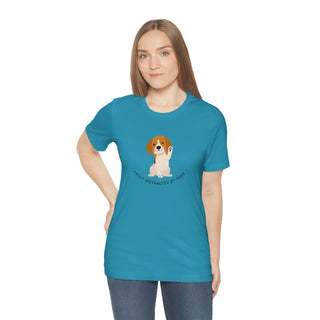 Easily Distracted Unisex Jersey Short Sleeve Tee in Aqua. Shown is front design featuring a dog waving with the saying "Easily Distracted by Dogs" below it. The back of shirt has the classic Benefit Beagle Logo.