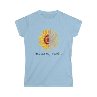 You are my Sunshine Women's Softstyle Tee in Light Blue. Shown is the front showcasing a sunflower which is split down the middle and half is made out of paw prints. Underneath is the phrase "You are my Sunshine" . Back of shirt features the Sunflower Benefit Beagle Logo.