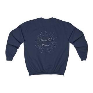 Live in the Moment Crewneck Sweatshirt in Navy. The Live in the Moment design features a graphic on the back with the phrase "Live in the Moment" surrounded by shooting stars.