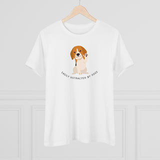 Easily Distracted Women's Premium Tee in  White. Shown is front design featuring a dog waving with the saying "Easily Distracted by Dogs" below it. The back of shirt has the classic Benefit Beagle Logo.