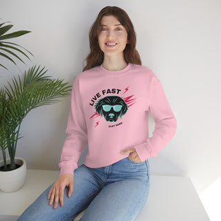 Play Hard Unisex Heavy Blend Crewneck Sweatshirt in Pink. The design features a cool dog with sunglasses and lightening bolts around it. The phrase "Live Fast, Play Hard" is around the design.