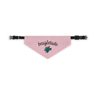 The Signature Tattoo Roses Dog Collar Bandana in Pink. The Signature Tattoo Roses design features the word "beagletude" with a tattoo style rose under it. Comes with adjustable black collar.