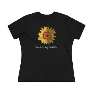 You are my Sunshine Women's Premium Tee shirt in Black. Shown is the front showcasing a sunflower which is split down the middle and half is made out of paw prints. Underneath is the phrase "You are my Sunshine" . Back of shirt features the Sunflower Benefit Beagle Logo.