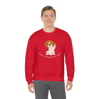 Easily Distracted Unisex Heavy Blend Crewneck Sweatshirt in Red. Shown is front design featuring a dog waving with the saying "Easily Distracted by Dogs" below it. The back of shirt has the classic Benefit Beagle Logo.