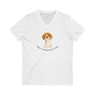 Easily Distracted Unisex Jersey Short Sleeve V-Neck Tee in White. Shown is front design featuring a dog waving with the saying "Easily Distracted by Dogs" below it. The back of shirt has the classic Benefit Beagle Logo.