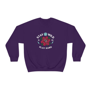 Stay Wild Unisex Heavy Blend Crewneck Sweatshirt in Purple. The Stay Wild Design features a tattoo style rose with the phrase "Stay Wild, Play Hard" around it. The back of shirt features the Stay Wild Benefit Beagle Logo Design.