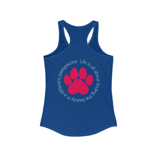 Different Pawspective Women's Racerback Tank in Royal. Shown is the back of shirt featuring a large colorful pawprint with the the phrase "Life is all about finding the beauty in a different pawspective" circled around it. The Benefit Beagle Logo is located in the top corner on the front of shirt.