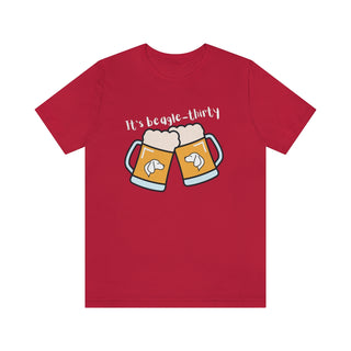 Beagle-Thirty Mugs Unisex Jersey Short Sleeve Tee in Red. The front of shirt showcases Two Dog Adorned Mugs clinking with the saying, "It's Beagle-Thirty" above it. Back of shirt features corresponding Benefit Beagle Logo.