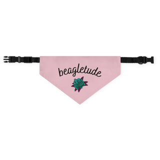 The Signature Tattoo Roses Dog Collar Bandana in Pink. The Signature Tattoo Roses design features the word "beagletude" with a tattoo style rose under it. Comes with adjustable black collar.