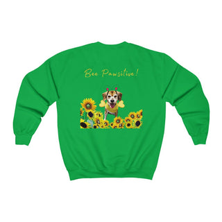 Bee Pawsitive Unisex Crewneck Sweatshirt shirt in Irish Green. Shown is back of shirt showcasing a dog dressed as as bee in a a field of sunflowers with the phrase "Bee Pawsitive!" above it. The front features the Bee Pawsitive Benefit Beagle Logo.