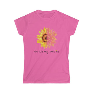 You are my Sunshine Women's Softstyle Tee in Azalea. Shown is the front showcasing a sunflower which is split down the middle and half is made out of paw prints. Underneath is the phrase "You are my Sunshine" . Back of shirt features the Sunflower Benefit Beagle Logo.