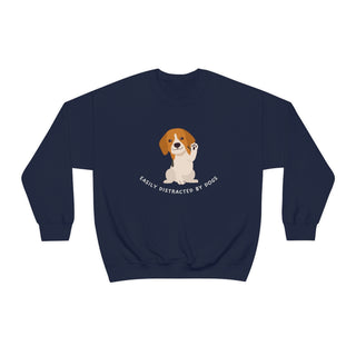 Easily Distracted Unisex Heavy Blend Crewneck Sweatshirt in Navy. Shown is front design featuring a dog waving with the saying "Easily Distracted by Dogs" below it. The back of shirt has the classic Benefit Beagle Logo.