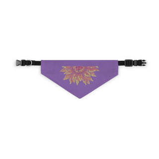 You are my Sunshine Pet Bandana Collar in Purple. The You are my Sunshine design features half of a sunflower made out of little paw prints. Comes with adjustable black collar.