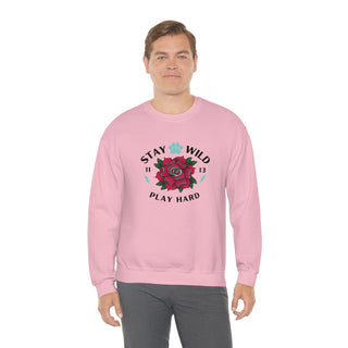 Stay Wild Unisex Heavy Blend Crewneck Sweatshirt in Pink. The Stay Wild Design features a tattoo style rose with the phrase "Stay Wild, Play Hard" around it. The back of shirt features the Stay Wild Benefit Beagle Logo Design.