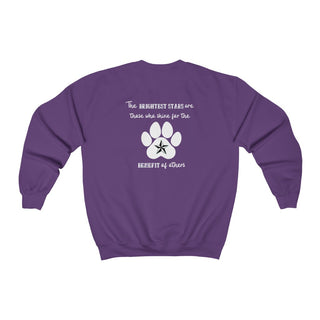 Brightest Star unisex Crewneck Sweatshirt in purple. The Brightest Star design features a design on the back with the phrase "The brightest stars are those who shine for the benefit of others" with a pawprint and a nautical star.