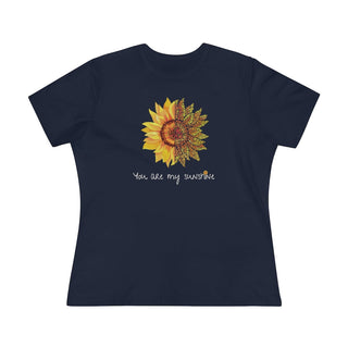 You are my Sunshine Women's Premium Tee shirt in Navy. Shown is the front showcasing a sunflower which is split down the middle and half is made out of paw prints. Underneath is the phrase "You are my Sunshine" . Back of shirt features the Sunflower Benefit Beagle Logo.