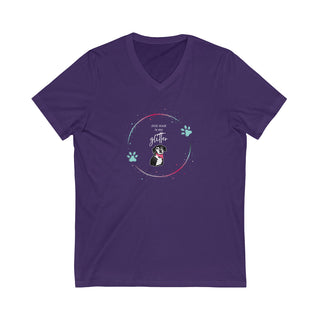 Dog Hair is my Glitter Unisex Jersey V-Neck Tee in Team Purple. The Dog Hair is my Glitter design features a dog with the phrase "Dog Hair is my Glitter" above it and it is surrounded by a circle with paw prints.